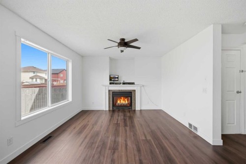50 Saddleback Road Ne, Calgary, AB - Indoor Photo Showing Living Room With Fireplace