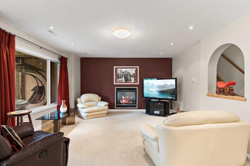 180 Cranfield Park Se, Calgary, AB - Indoor Photo Showing Living Room With Fireplace