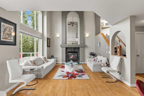 180 Cranfield Park Se, Calgary, AB - Indoor Photo Showing Living Room With Fireplace