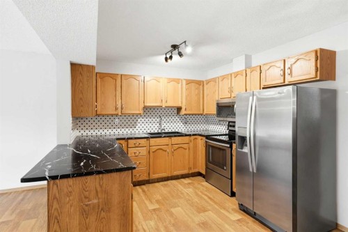4B Millview Way Sw, Calgary, AB - Indoor Photo Showing Kitchen