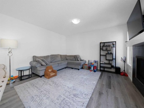62 Yorkstone Heath Sw, Calgary, AB - Indoor With Fireplace