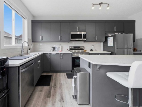 62 Yorkstone Heath Sw, Calgary, AB - Indoor Photo Showing Kitchen With Double Sink With Upgraded Kitchen