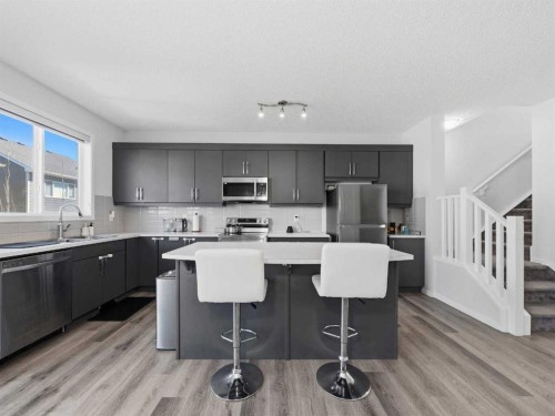62 Yorkstone Heath Sw, Calgary, AB - Indoor Photo Showing Kitchen With Upgraded Kitchen