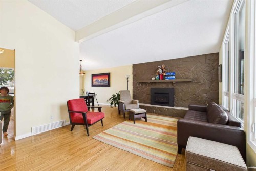 5219 Viceroy Drive Nw, Calgary, AB - Indoor Photo Showing Living Room With Fireplace