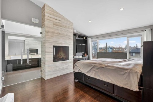 2718 19 Street Sw, Calgary, AB - Indoor Photo Showing Bedroom With Fireplace