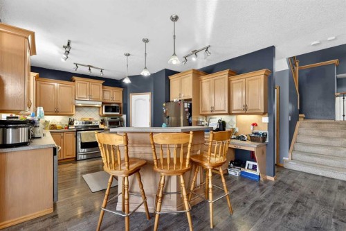765 Qualicum Beach Bay, Chestermere, AB - Indoor Photo Showing Kitchen With Upgraded Kitchen