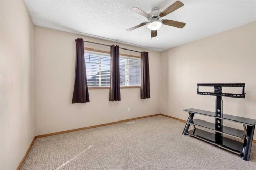 765 Qualicum Beach Bay, Chestermere, AB - Indoor Photo Showing Other Room