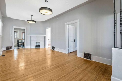 226 11 Street Nw, Calgary, AB - Indoor Photo Showing Other Room With Fireplace
