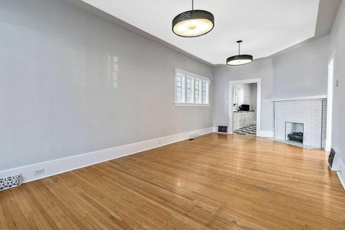 226 11 Street Nw, Calgary, AB - Indoor With Fireplace