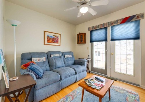 38 Spokane Street Sw, Calgary, AB - Indoor Photo Showing Living Room