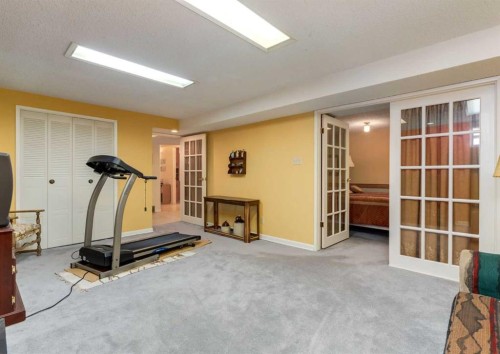 38 Spokane Street Sw, Calgary, AB - Indoor Photo Showing Gym Room