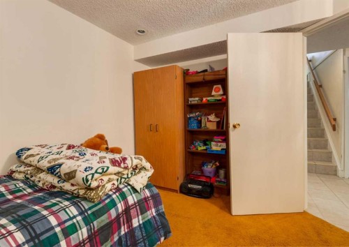 38 Spokane Street Sw, Calgary, AB - Indoor Photo Showing Bedroom