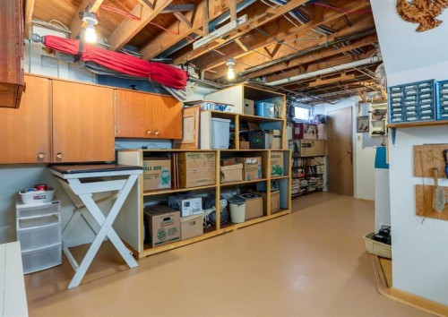 38 Spokane Street Sw, Calgary, AB - Indoor Photo Showing Basement