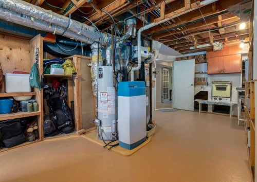 38 Spokane Street Sw, Calgary, AB - Indoor Photo Showing Basement