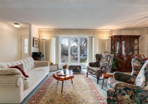 38 Spokane Street Sw, Calgary, AB - Indoor Photo Showing Living Room