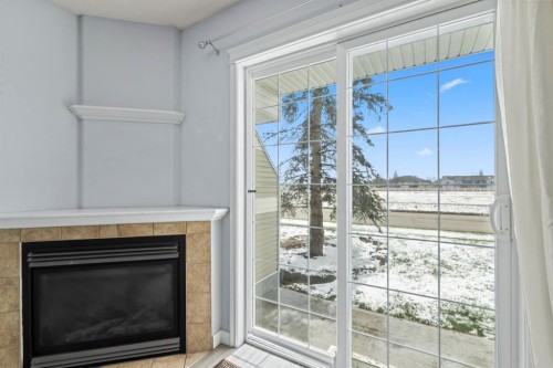 313-103 Strathaven Drive, Strathmore, AB - Indoor Photo Showing Living Room With Fireplace