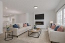 208 Belmont Way Sw, Calgary, AB  - Indoor Photo Showing Living Room With Fireplace 