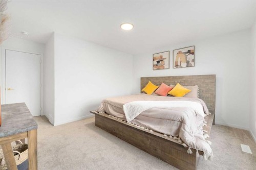 30 Edith Manor Nw, Calgary, AB - Indoor Photo Showing Bedroom