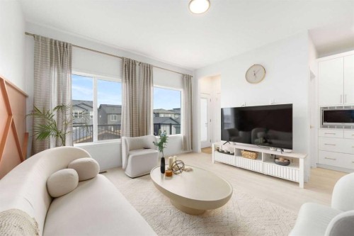 30 Edith Manor Nw, Calgary, AB - Indoor Photo Showing Living Room