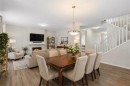 33 Carringham Heights Nw, Calgary, AB  - Indoor Photo Showing Dining Room With Fireplace 