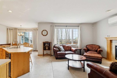 37 Cimarron Trail, Okotoks, AB - Indoor Photo Showing Living Room With Fireplace