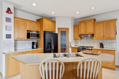 37 Cimarron Trail, Okotoks, AB - Indoor Photo Showing Kitchen With Double Sink