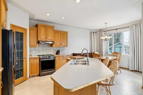 37 Cimarron Trail, Okotoks, AB - Indoor Photo Showing Kitchen With Double Sink
