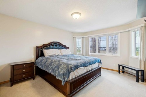 37 Cimarron Trail, Okotoks, AB - Indoor Photo Showing Bedroom