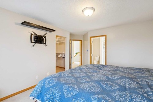 37 Cimarron Trail, Okotoks, AB - Indoor Photo Showing Bedroom
