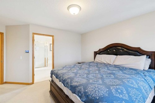 37 Cimarron Trail, Okotoks, AB - Indoor Photo Showing Bedroom