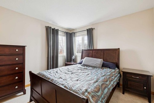 37 Cimarron Trail, Okotoks, AB - Indoor Photo Showing Bedroom