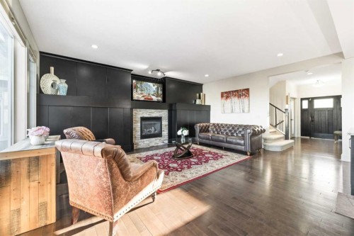 52 Aspen Summit Drive Sw, Calgary, AB - Indoor Photo Showing Living Room With Fireplace