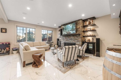 52 Aspen Summit Drive Sw, Calgary, AB - Indoor Photo Showing Living Room With Fireplace
