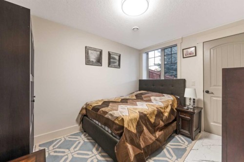 52 Aspen Summit Drive Sw, Calgary, AB - Indoor Photo Showing Bedroom