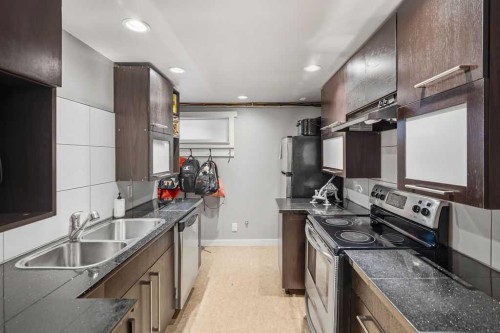 86 Warwick Drive Sw, Calgary, AB - Indoor Photo Showing Kitchen With Double Sink