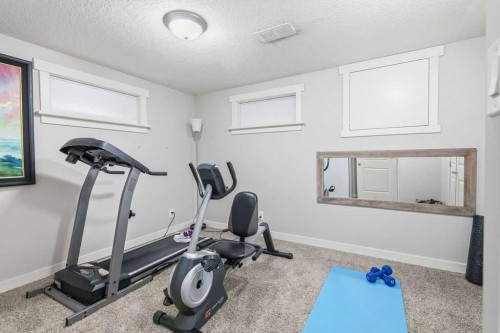 86 Warwick Drive Sw, Calgary, AB - Indoor Photo Showing Gym Room