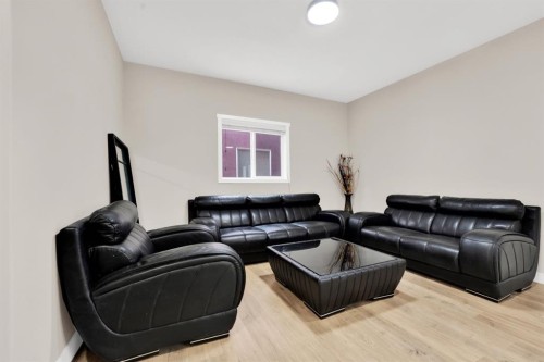 360 Saddlemont Boulevard Ne, Calgary, AB - Indoor Photo Showing Living Room