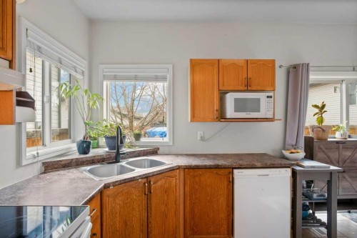 14760 Mt Mckenzie Drive Se, Calgary, AB - Indoor Photo Showing Kitchen With Double Sink