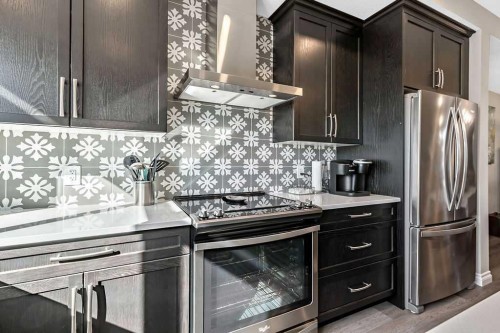 91 Wolf Hollow Park Se, Calgary, AB - Indoor Photo Showing Kitchen With Stainless Steel Kitchen