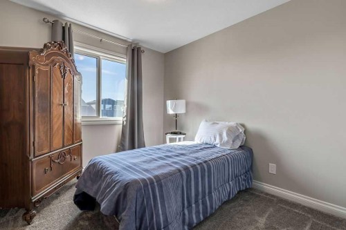 91 Wolf Hollow Park Se, Calgary, AB - Indoor Photo Showing Bedroom