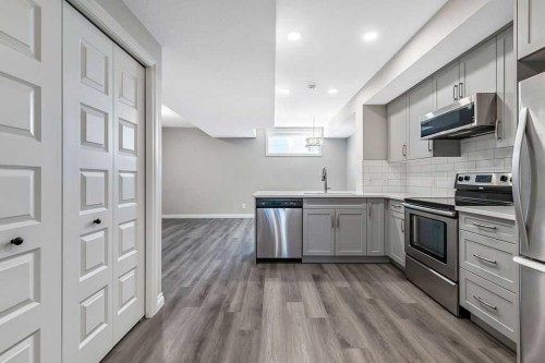 91 Wolf Hollow Park Se, Calgary, AB - Indoor Photo Showing Kitchen With Stainless Steel Kitchen With Upgraded Kitchen