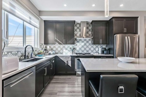 91 Wolf Hollow Park Se, Calgary, AB - Indoor Photo Showing Kitchen With Stainless Steel Kitchen With Double Sink With Upgraded Kitchen
