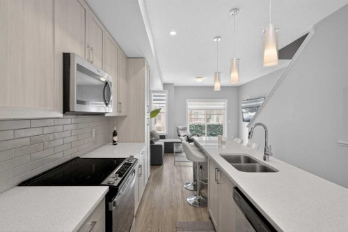 930 Sage Hill Grove Nw, Calgary, AB - Indoor Photo Showing Kitchen With Double Sink With Upgraded Kitchen