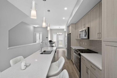 930 Sage Hill Grove Nw, Calgary, AB - Indoor Photo Showing Kitchen With Double Sink With Upgraded Kitchen