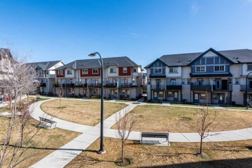 173 New Brighton Point Se, Calgary, AB - Outdoor With Balcony With Facade