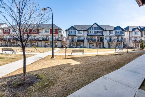 173 New Brighton Point Se, Calgary, AB - Outdoor With Balcony With Facade