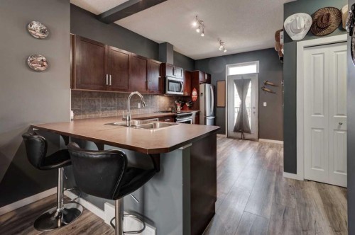173 New Brighton Point Se, Calgary, AB - Indoor Photo Showing Kitchen With Double Sink