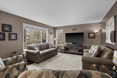 66 Tuscany Reserve Gate Nw, Calgary, AB - Indoor Photo Showing Living Room