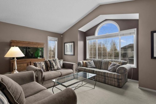 66 Tuscany Reserve Gate Nw, Calgary, AB - Indoor Photo Showing Living Room
