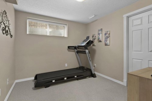 66 Tuscany Reserve Gate Nw, Calgary, AB - Indoor Photo Showing Gym Room